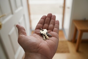 Man presents keys to new home