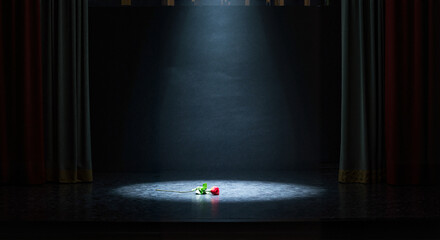 Spotlight on colorful props on empty stage in theater  