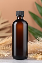 Amber bottle mockup with black cap in soft natural setting with botanical elements