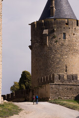 Couple walking in Carcassone Castle in France
