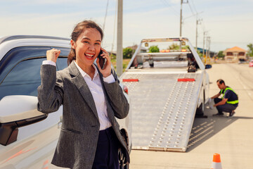 Happy asian businesswoman car broke down while traveling uses smartphone contact help emergency...