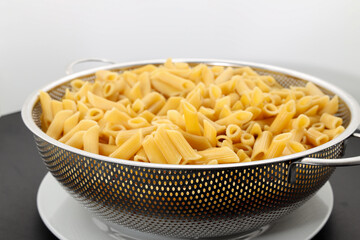 Pasta Penne bowl pre-cook white background