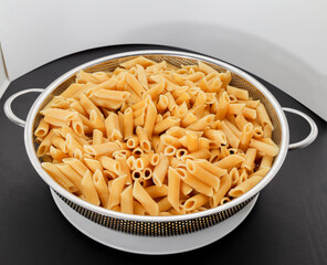 Pasta Penne bowl pre-cook white background