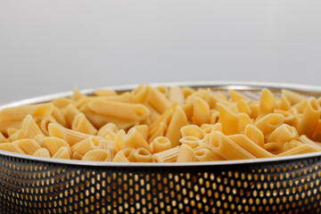 Pasta Penne bowl pre-cook white background