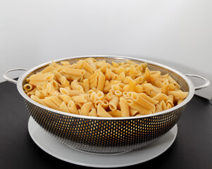 Pasta Penne bowl pre-cook white background