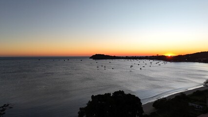 First light touches the ocean as the day begins — golden skies, calm seas, and nature in perfect...