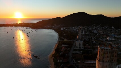 First light touches the ocean as the day begins — golden skies, calm seas, and nature in perfect...