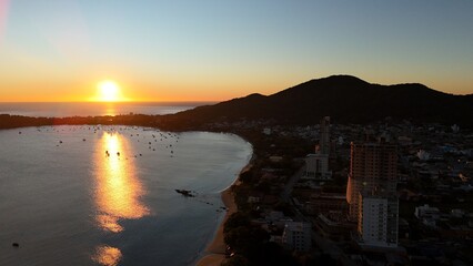 First light touches the ocean as the day begins — golden skies, calm seas, and nature in perfect...