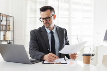 Marketing. Man working at desk in office