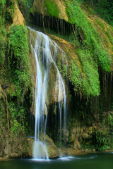 Pha Nam Yod Waterfall is 35 meters high and consists of three levels, shaped like umbrellas. It is...