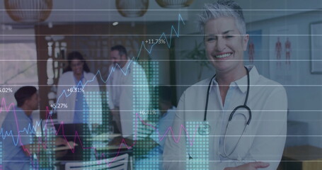 Smiling doctor in white blouse standing in clinic, with stethoscope, tablet and graph, copy space