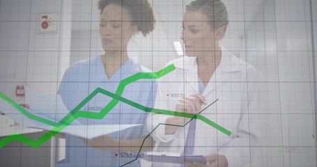 Medical staff in uniform reviewing data in hospital hall holding charts on clipboard, graph overlay
