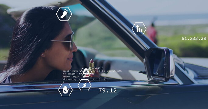 Driving woman wearing aviator sunglasses cruising convertible on coastal road, AR icons, copy space