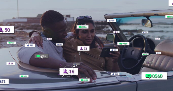 Couple leaning, browsing smartphone in convertible at coastal overlook, with social media overlays