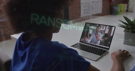 Joining call blue-shirted worker at office desk, with laptop and ransomware overlay, copy space