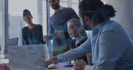 Five professionals reviewing data around conference room table, with laptop and code overlay