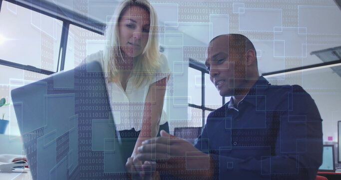 Collaborating professionals reviewing data overlay on laptop in office, with smartphone