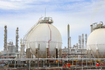 Liquid oil tanks are raw materials for production : Oil refineries from industrial estates in...