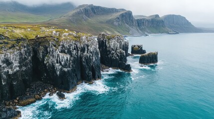 Stunning Rocky Cliffs and Turquoise Waters on a Misty Day