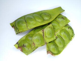 Fresh Green Parkia Speciosa or Bitter Bean with Pod and Seeds on White Background – Close-Up of...
