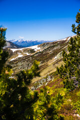 Fototapeta premium Snowy spring peaks of the Ariège mountains from the Col de la Coumeille de l’Ours
