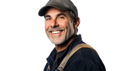 Smiling Male Worker in Casual Attire with Cap and Dark Shirt Against Black Background for Inspirational Work and Construction Themes