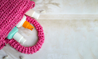 Sunscreen stick and spf cream in a straw bag . Sun Protection Face Cream