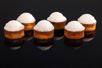 Tasty sweet dessert. Coconut tartlets with gluten-free sponge cake, pineapple kulie, coconut...