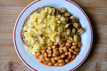Scrambled Eggs Fried Mushrooms Baked Beans and Tomato Sauce
