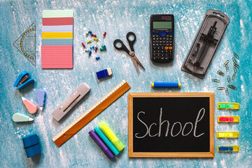Chalkboard with “School” Text and Supplies
