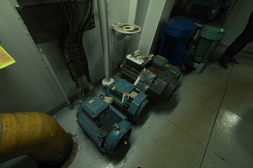 Cruise ship engine room interior with water tight doors electrical and diesel engines, water pipes, measuring instruments, diesel engines