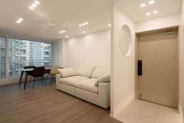 The front door is beige, creating a warm atmosphere