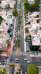Top-down drone shot of busy roads with cars.