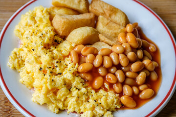 Scrambles Eggs With Baked Beans In Tomato Sauce And Thick Cut Fried Chips
