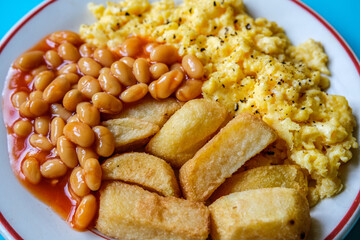 Scrambles Eggs With Baked Beans In Tomato Sauce And Thick Cut Fried Chips
