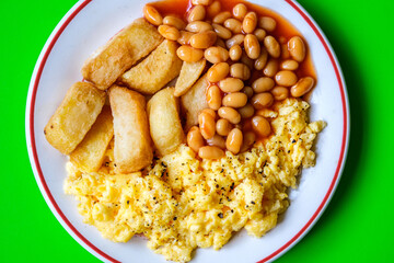 Scrambles Eggs With Baked Beans In Tomato Sauce And Thick Cut Fried Chips