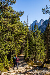 Young hiker woman in autumn in Aiguestortes and Sant Maurici National Park, Spain
