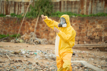 Environment scientist with waste water sample in tube showing thumb down. Testing result, researching and analysing at site for ecosystem education