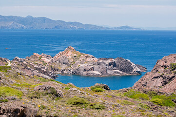 Rocky coastline with distant mountains