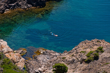 Swimmer in a hidden cove
