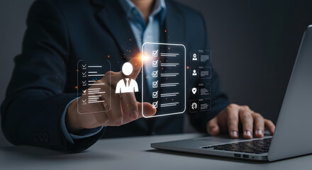 Businessman using virtual checklist on laptop