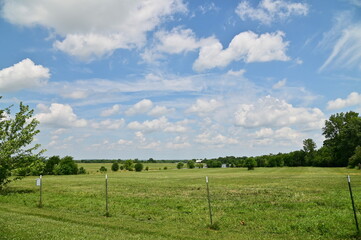 Blue Sky and Clouds Over a Rural Field