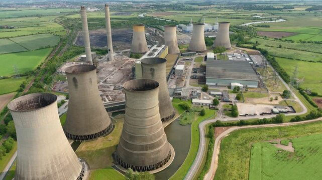 Aerial drone view of West Burton power station plant energy generation gas coal fuel electricity smoke stacks cooling towers.