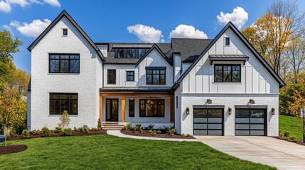 A spacious, modern farmhouse style home with white brick and black trim.