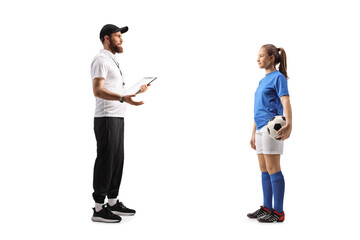 Obraz premium Coach talking to a female teenage football player