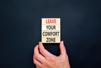 Leave your comfort zone symbol. Concept words Leave your comfort zone on beautiful wooden blocks....