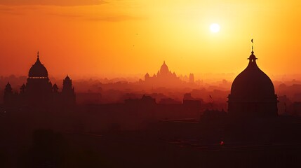 Naklejka premium Sunset skyline of New Delhi with silhouette of historical domes and towers
