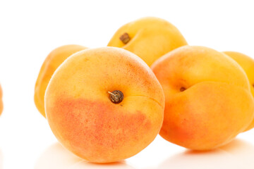 Sweet organic apricots isolated on white background, close-up.