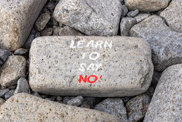 Learn to say no symbol. Concept words phrase Learn to say no on beautiful grey stone. Beautiful...