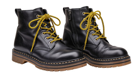 Black leather boots with yellow laces on white background  